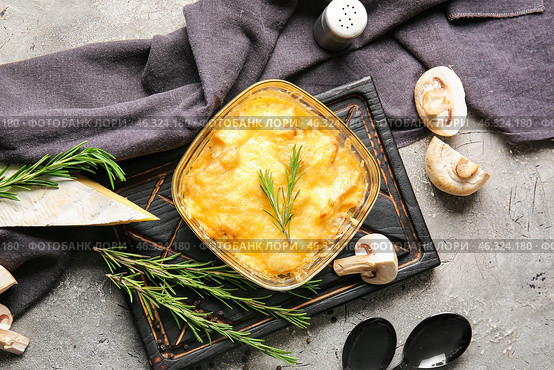 Baking dish with tasty julienne and ingredients on grey background. Стоковое фото, фотограф Pixel_shot / Фотобанк Лори