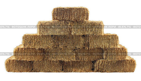 Bale of hay group in a pyramid wall pattern isolated on a white background as a country living design element and agriculture farm and farming symbol of harvest time with dried grass straw as bundled tied haystacks. Стоковое фото, агентство Ingram Publishing / Фотобанк Лори