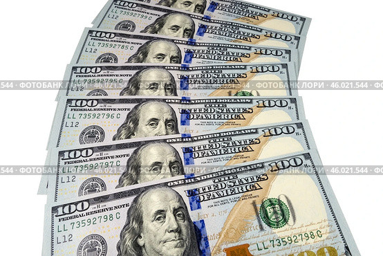 Банкноты американских долларов. Background of the one hundred dollar banknotes. Стоковое фото, фотограф Татьяна Д / Фотобанк Лори
