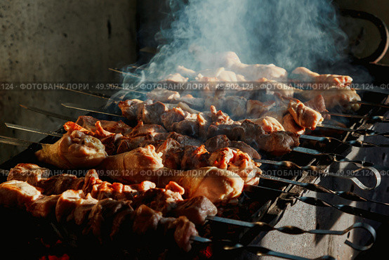 Barbecue Skewers With Chicken and Meat Roasting on Grill Outdoors. Стоковое фото, фотограф Aleksandr Golubev / Фотобанк Лори