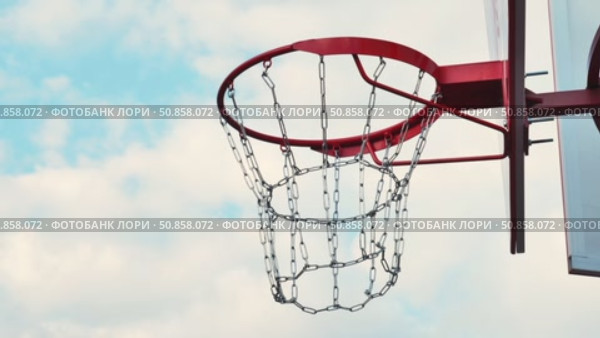 Basketball going through hoop during sports day. Стоковое видео, видеограф Mikhail Davidovich / Фотобанк Лори