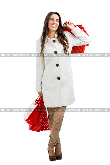 Beautiful happy woman holding shopping bags, isolated over a white background. Стоковое фото, агентство Ingram Publishing / Фотобанк Лори