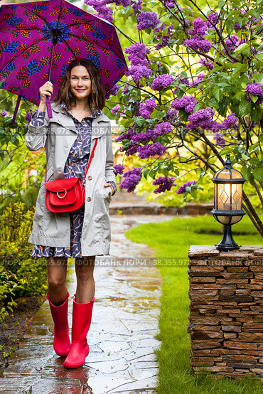 Beautiful middle-aged woman with an umbrella. Стоковое фото, фотограф Astroid / Фотобанк Лори