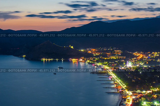 Beautiful view of the night embankment of the city of Sudak after sunset. South coast of the Crimean peninsula. Russia. Стоковое фото, фотограф Константин Лабунский / Фотобанк Лори