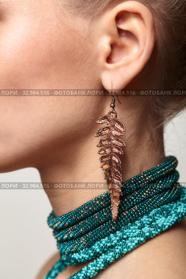 Beautiful woman in collar and galvanic earring in form of fern leaf. Стоковое фото, фотограф Сергей Пристяжнюк (Serg Zastavkin) / Фотобанк Лори