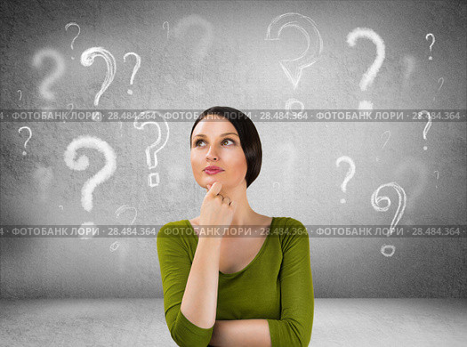 Beautiful woman with questioning expression and question marks above her head. Стоковое фото, фотограф Kirill Kedrinskiy / Ingram Publishing / Фотобанк Лори