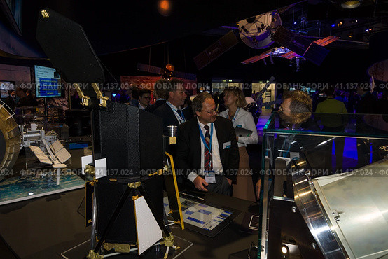 BERLIN, GERMANY - JUNE 01, 2016: The specialists on the stand of German Max Planck Institute for Extraterrestrial Physics. Exhibition ILA Berlin Air Show 2016. Редакционное фото, фотограф Sergey Kohl / Фотобанк Лори