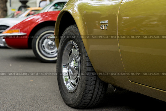 BERLIN - MAY 10, 2025: Row of classic Opel GT cars (1968-1973) at Berlin Classic Days. German sports coupes in formation. Focus on the foreground. Редакционное фото, фотограф Sergey Kohl / Фотобанк Лори