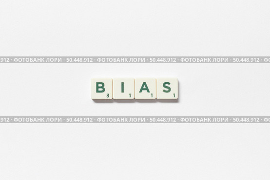 Bias word formed of scrabble tiles on white background. Social awareness and education concept.. Bias formed of scrabble tiles on white background. Стоковое фото, агентство Ingram Publishing / Фотобанк Лори