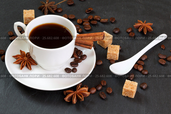Black coffee with cinnamon, anise and cane sugar. Стоковое фото, фотограф Феликс Хромых / Фотобанк Лори