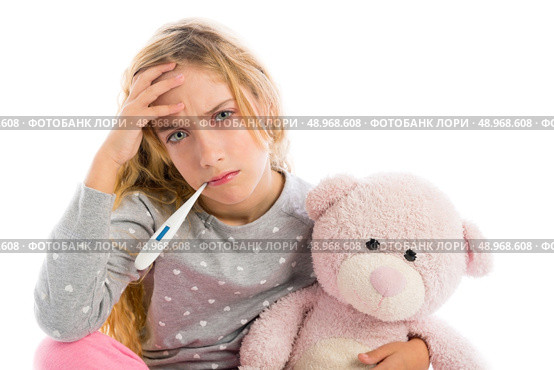 blond girl with thermometer and flu cold in pyjama  grumpy face with teddy bear. Стоковое фото, агентство Ingram Publishing / Фотобанк Лори