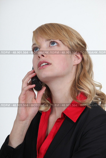 Blond office becoming stressed during telephone call. Стоковое фото, агентство Ingram Publishing / Фотобанк Лори