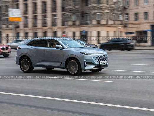 Blue Changan UNI-K SUV car on the city road. Fast moving vehicle on Moscow streets. Compliance with speed limits on the road. Редакционное фото, фотограф Константин Григорьев / Фотобанк Лори