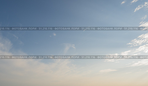 Blue sky with scattered white cirrus clouds. The. Стоковое фото, фотограф Екатерина Золина / Фотобанк Лори