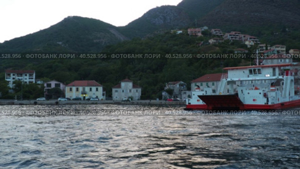 Boka Kotor Adriatic Sea, Verige Strait Kamenari Lepetane Ferry Line Trajekt. Ferryboat for passenger, cargo and vehicles. Tourism and business in Montenegro. Maritime transport coastal. August 16 2022. Стоковое видео, видеограф Юлия Петровская / Фотобанк Лори