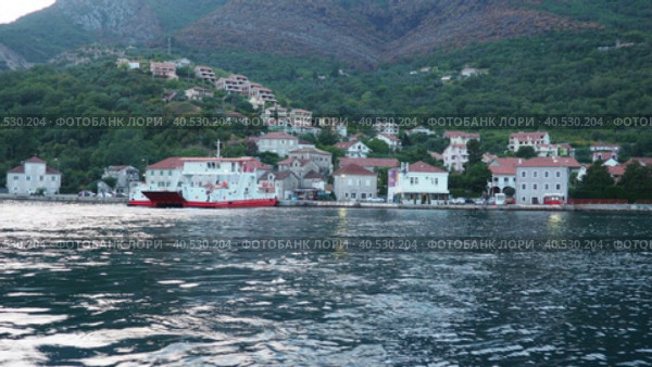 Boka Kotor Adriatic Sea, Verige Strait Kamenari Lepetane Ferry Line Trajekt. Ferryboat for passenger, cargo and vehicles. Tourism and business in Montenegro. Maritime transport coastal. August 16 2022. Стоковое видео, видеограф Юлия Петровская / Фотобанк Лори