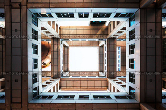 Bottom view on Headquarters of Fuji TV at Odaiba island. Fuji TV Studios building was designed by famous Kenzo Tange and is one of most recognized buildings in Japan.. Bottom view on Headquarters of Fuji TV at Odaiba island, Tokyo, Japan. Стоковое фото, агентство Ingram Publishing / Фотобанк Лори