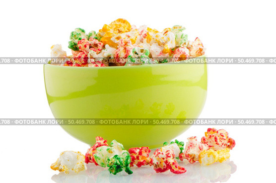 Bowl of popcorn on white reflective background. Стоковое фото, агентство Ingram Publishing / Фотобанк Лори