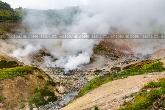 Breathtaking scenery view of volcanic landscape, aggressive hot spring, eruption fumarole, gas-steam activity in crater of active volcano. Стоковое фото, фотограф А. А. Пирагис / Фотобанк Лори