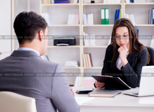 Business meeting between businessman and businesswoman. Стоковое фото, фотограф Elnur / Фотобанк Лори