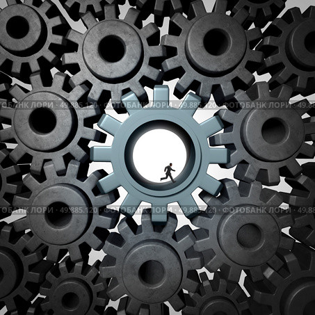 Businessman gear run concept as giant gears or cog wheels inside a network of machine parts being moved by a small person as a financial concept for economic engine or overworked essential employee productivity. Стоковое фото, агентство Ingram Publishing / Фотобанк Лори