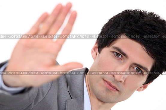Businessman holding his palm up. Стоковое фото, агентство Ingram Publishing / Фотобанк Лори