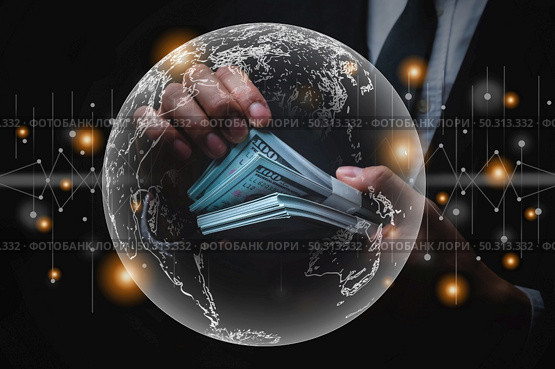 businessman holding money on hand, money economic and marketing concept with world map graphic, global digital finance market trade, stock datum chart success. Стоковое фото, агентство Ingram Publishing / Фотобанк Лори