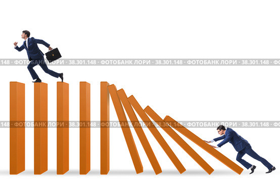 Businessman in domino effect concept. Стоковое фото, фотограф Elnur / Фотобанк Лори