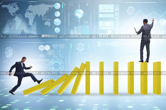 Businessman in domino effect concept. Стоковое фото, фотограф Elnur / Фотобанк Лори