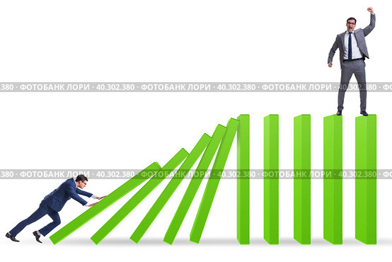 Businessman in domino effect concept. Стоковое фото, фотограф Elnur / Фотобанк Лори