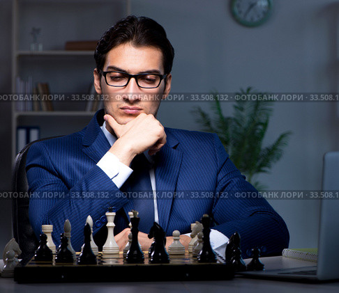 Businessman playing chess in strategy concept. Стоковое фото, фотограф Elnur / Фотобанк Лори