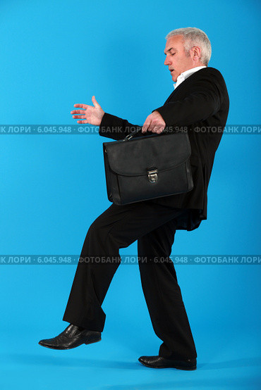 Businessman treading carefully. Стоковое фото, фотограф Phovoir Images / Фотобанк Лори