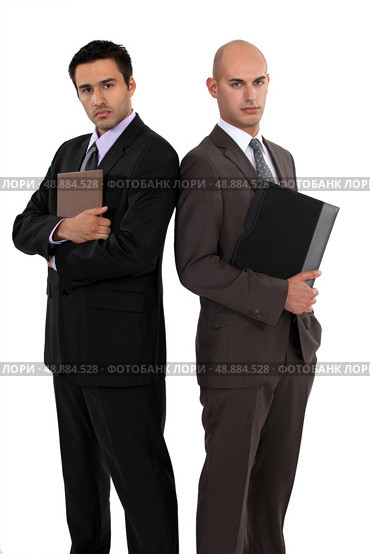 Businessmen standing back to back. Стоковое фото, агентство Ingram Publishing / Фотобанк Лори