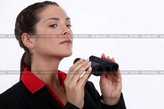 Businesswoman with binoculars. Стоковое фото, агентство Ingram Publishing / Фотобанк Лори