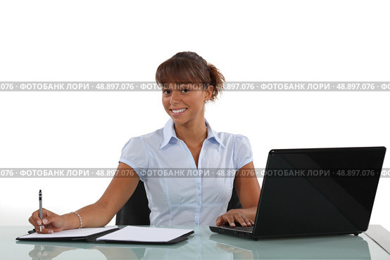 businesswoman working at her desk. Стоковое фото, агентство Ingram Publishing / Фотобанк Лори