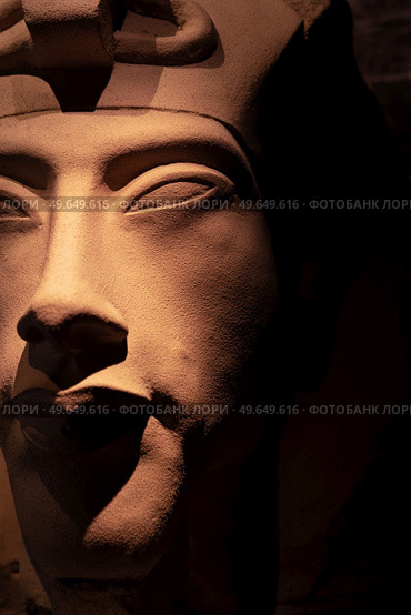 bust of pharaoh Echnaton (Akhenaten, aka Amenhotep IV) around black background . cloes up. Стоковое фото, агентство Ingram Publishing / Фотобанк Лори