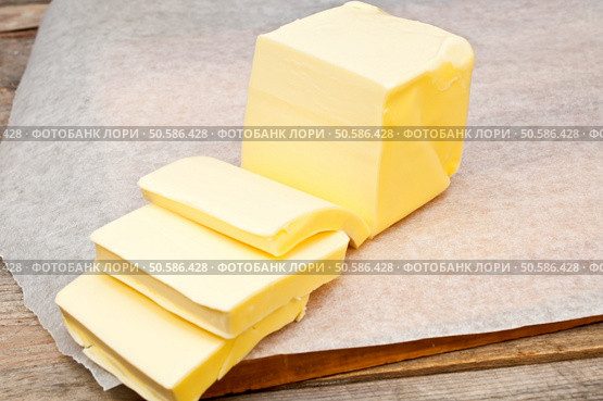 butter in parchment paper. Стоковое фото, агентство Ingram Publishing / Фотобанк Лори