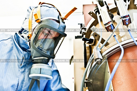 Calm In The Face of Danger - Female Hazmat / Hachem Scientist @ Work. Стоковое фото, агентство Ingram Publishing / Фотобанк Лори