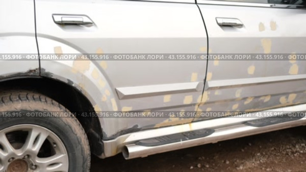 Car body shop. Repair man processes the welding seam using an angle grinder on replaced car part. Professional Body master grind old paint and rust. Rusty damage. Rusting car. Hands with tool close-up. Стоковое видео, видеограф Марина Демидюк / Фотобанк Лори
