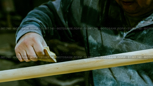 carpenter using nail gun or brad nailer tool on wood box in a workshop ,furniture restoration woodworking concept. selective focus. Стоковое фото, фотограф Feruza Tashmetova / Фотобанк Лори