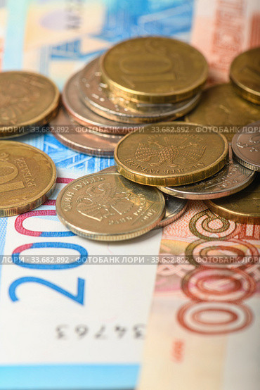 Cash banknotes and coins background. Background of Russian money banknotes. Paper rubles and coins background. Стоковое фото, фотограф Artem Sobov / Фотобанк Лори