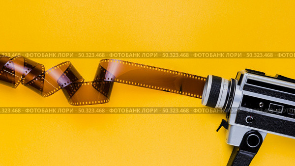 celluloid with vintage videocamera. Стоковое фото, агентство Ingram Publishing / Фотобанк Лори