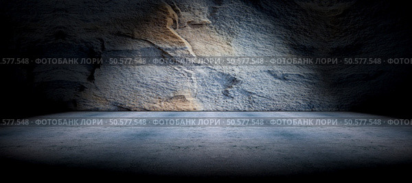 Cement floor and rock wall background and spotlight. Concrete and rock floor background. Стоковое фото, агентство Ingram Publishing / Фотобанк Лори