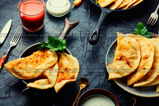 Chebureks making yeast dough, stuffing with minced beef. Delicious appetizing, chebureks. Стоковое фото, агентство Ingram Publishing / Фотобанк Лори