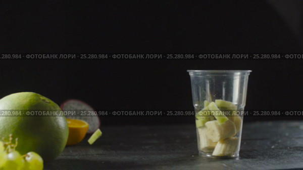 Chef Add Kiwi in Fruit Cocktail Cup with Banana. Стоковое видео, видеограф Станислав Панкратов / Фотобанк Лори
