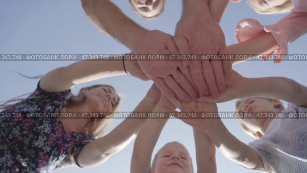 Children and parents join hands together. Joint success concept. Стоковое видео, видеограф Mikhail Davidovich / Фотобанк Лори