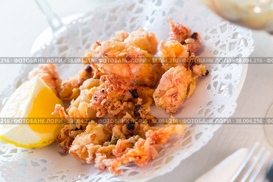 Chipirones, battered fried baby squid. Стоковое фото, фотограф Яков Филимонов / Фотобанк Лори