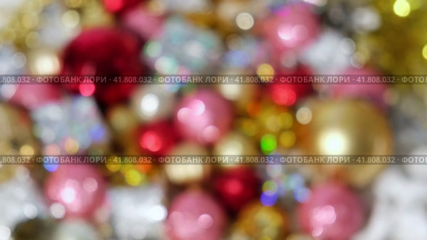 Christmas Ornaments Defocused Background Rotation. Close up a Glitter Christmas Tree Decoration Items Turning. Blurred Backdrop New Year Ornate. Many Shiny Xmas Bauble, Balls and Bulbs Bokeh. Top View. Стоковое видео, видеограф Марина Демидюк / Фотобанк Лори
