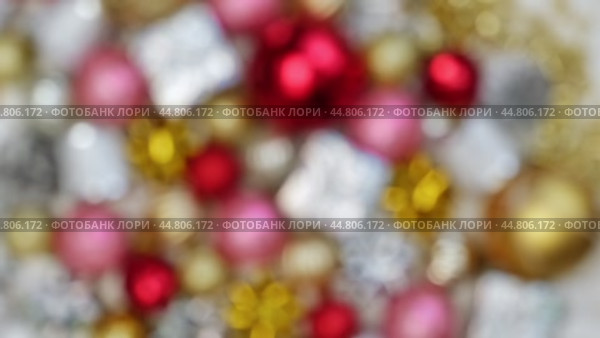 Christmas Ornaments Defocused Background Rotation. Close up a Glitter Christmas Tree Decoration Items Turning. Blurred Backdrop New Year Ornate. Many Shiny Xmas Bauble, Balls and Bulbs Bokeh. Top View. Стоковое видео, видеограф Марина Демидюк / Фотобанк Лори