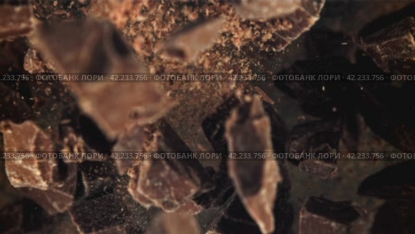 Chunks of chocolate fly up and fall down. Filmed on a high-speed camera at 1000 fps. Стоковое видео, видеограф Артем Шадрин / Фотобанк Лори